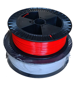 Spools of light gray and red filament